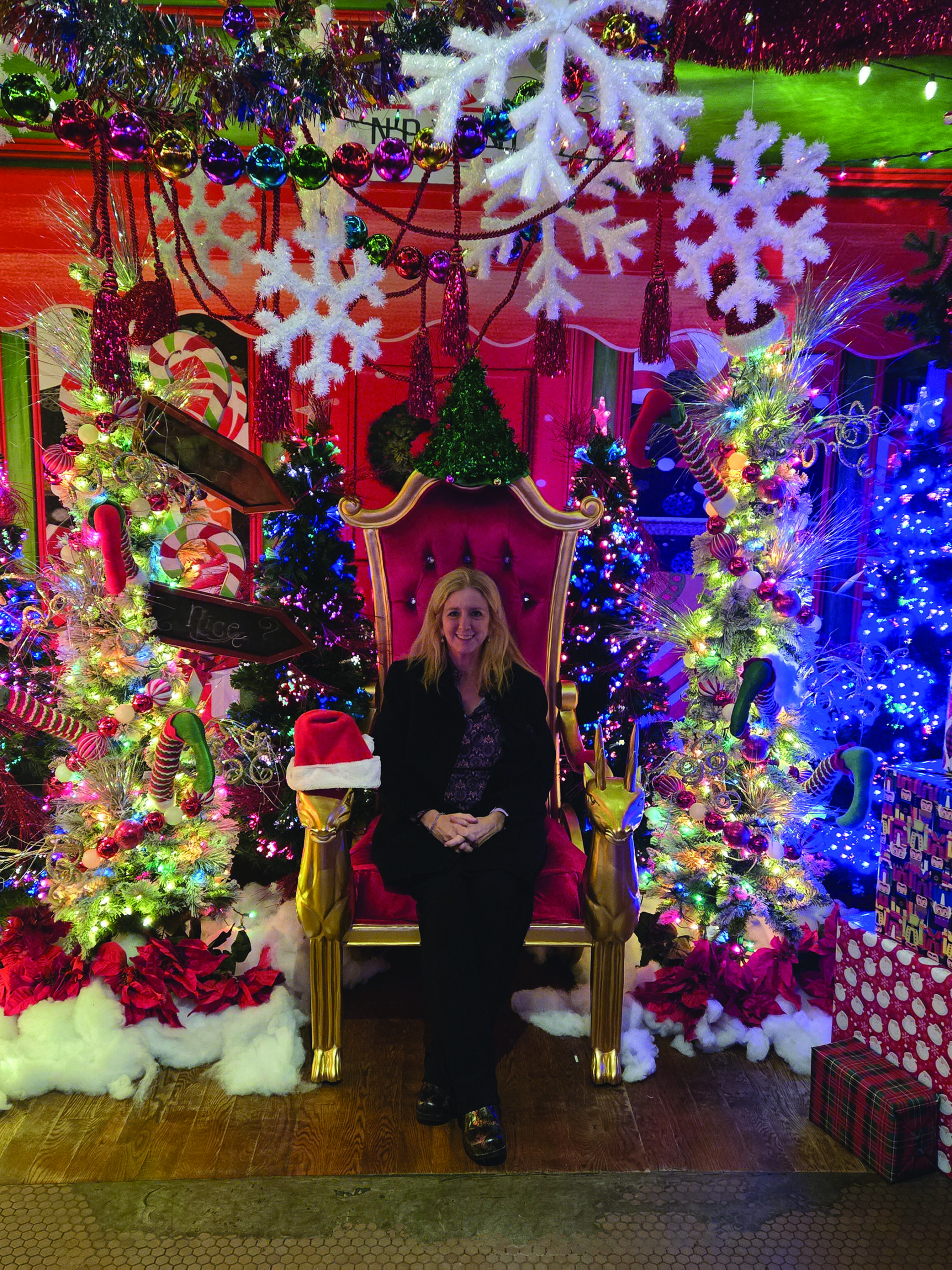 Santa's helper, Carla Pardue, at the winter wonderland display at Red Cow restaurant on Hennepin Avenue